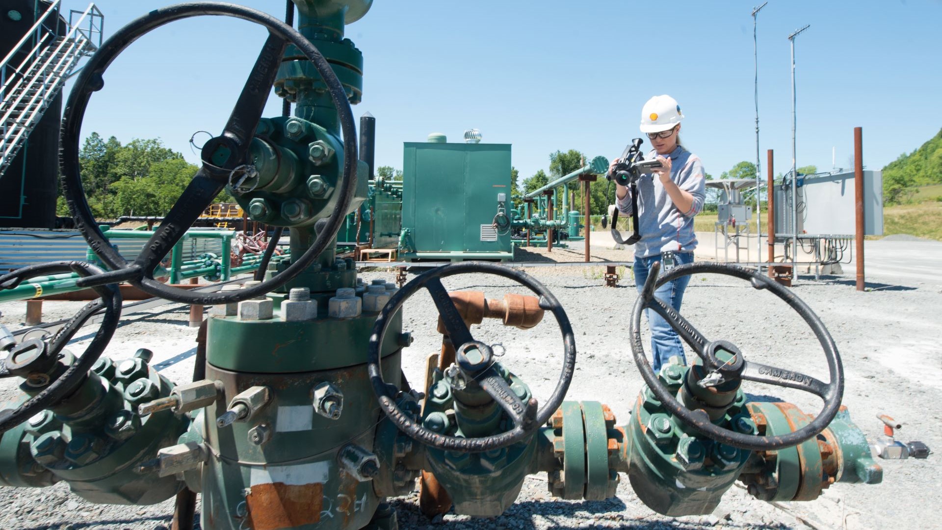 Engineer monitoring methane emissions