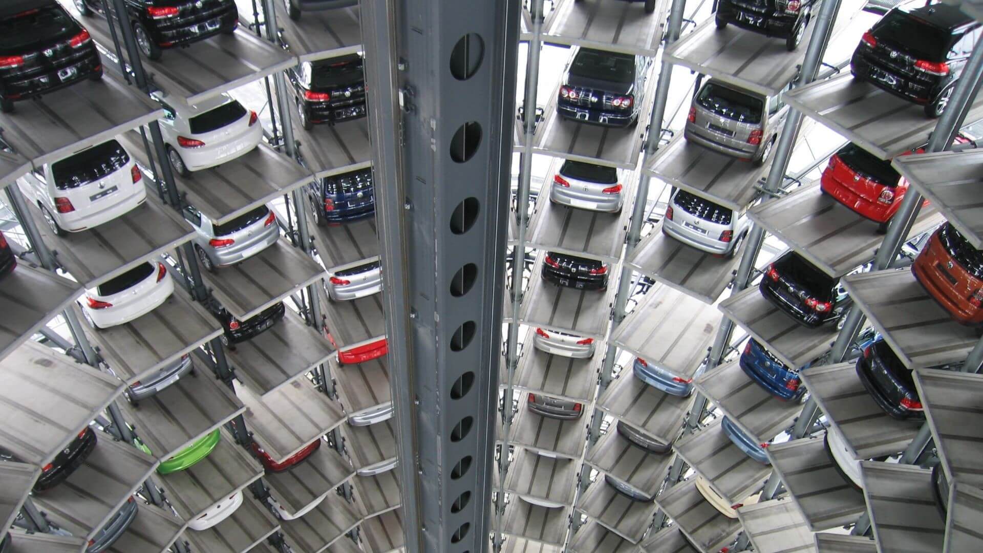 Stacks of cars parked in factory