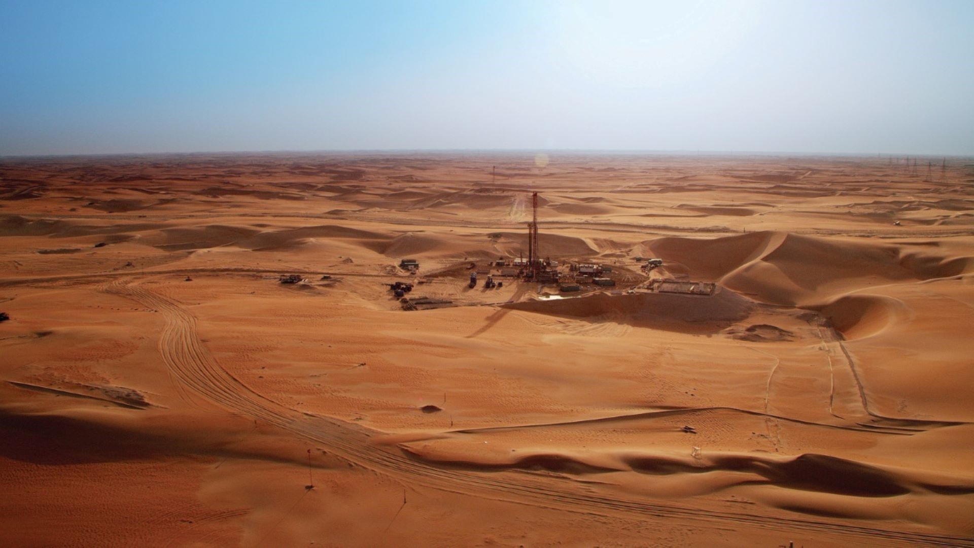 Aerial view of desert with site buildings and equipment