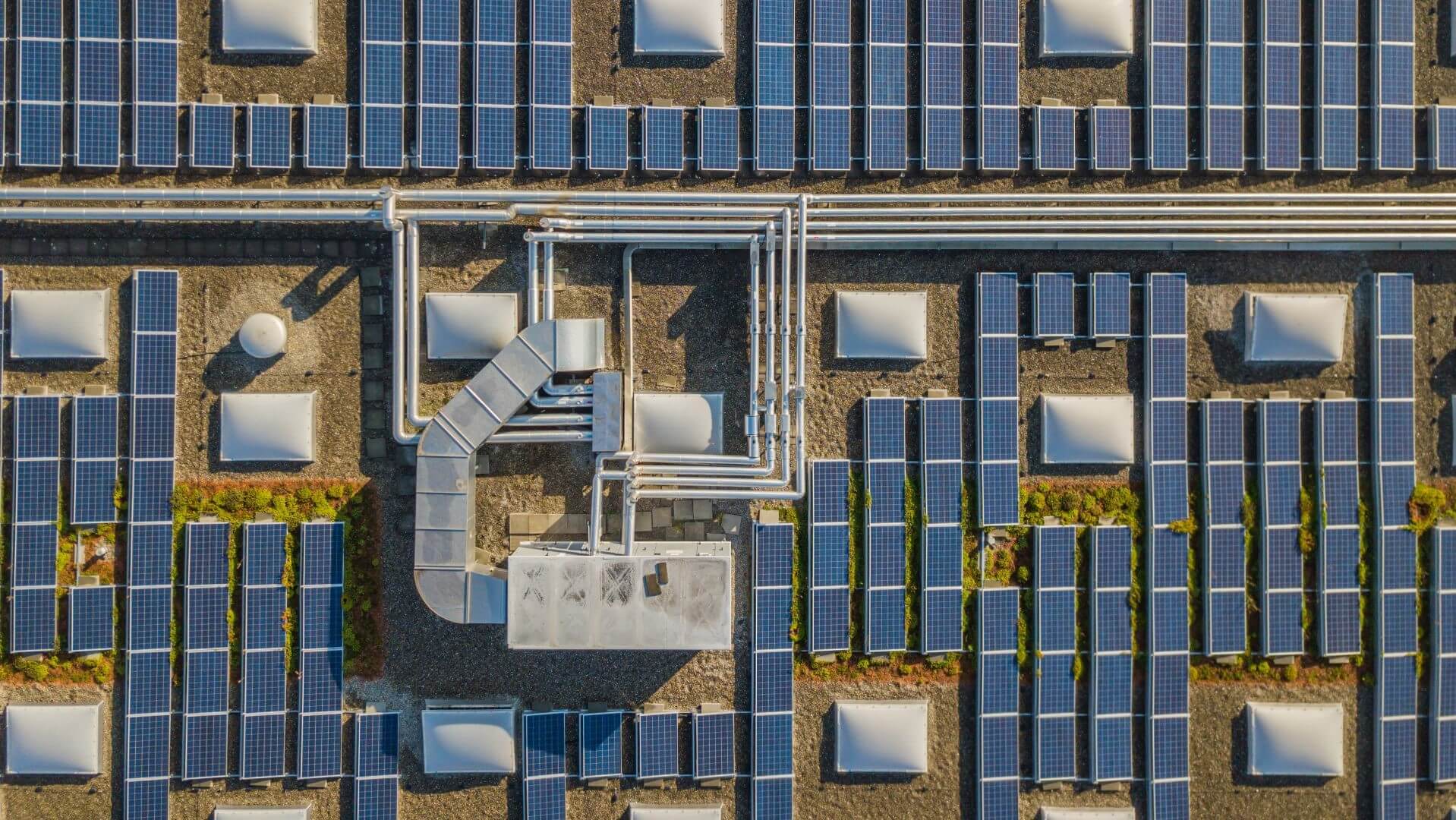 Aerial view of building with solar panels on the roof