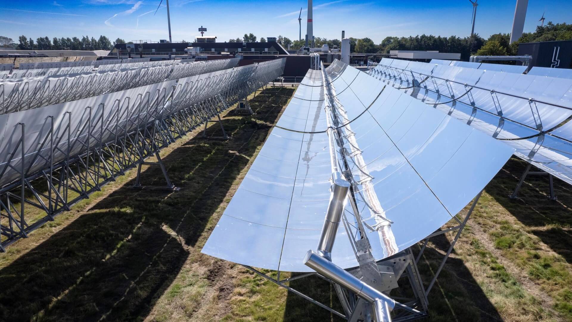 Rows of concentrated solar thermal panels in a field