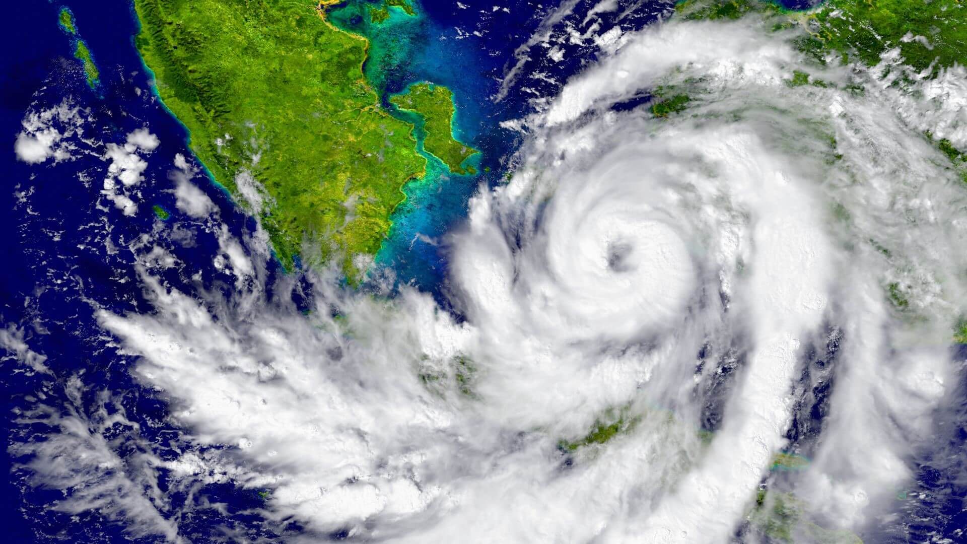 Satellite image of hurricane clouds swirling in circles over south-east Asia