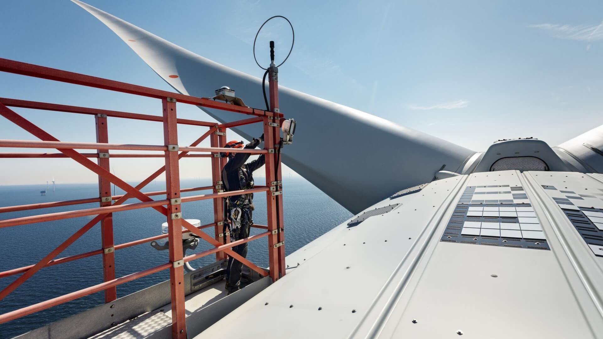 Offshore wind engineer working on top of turbine