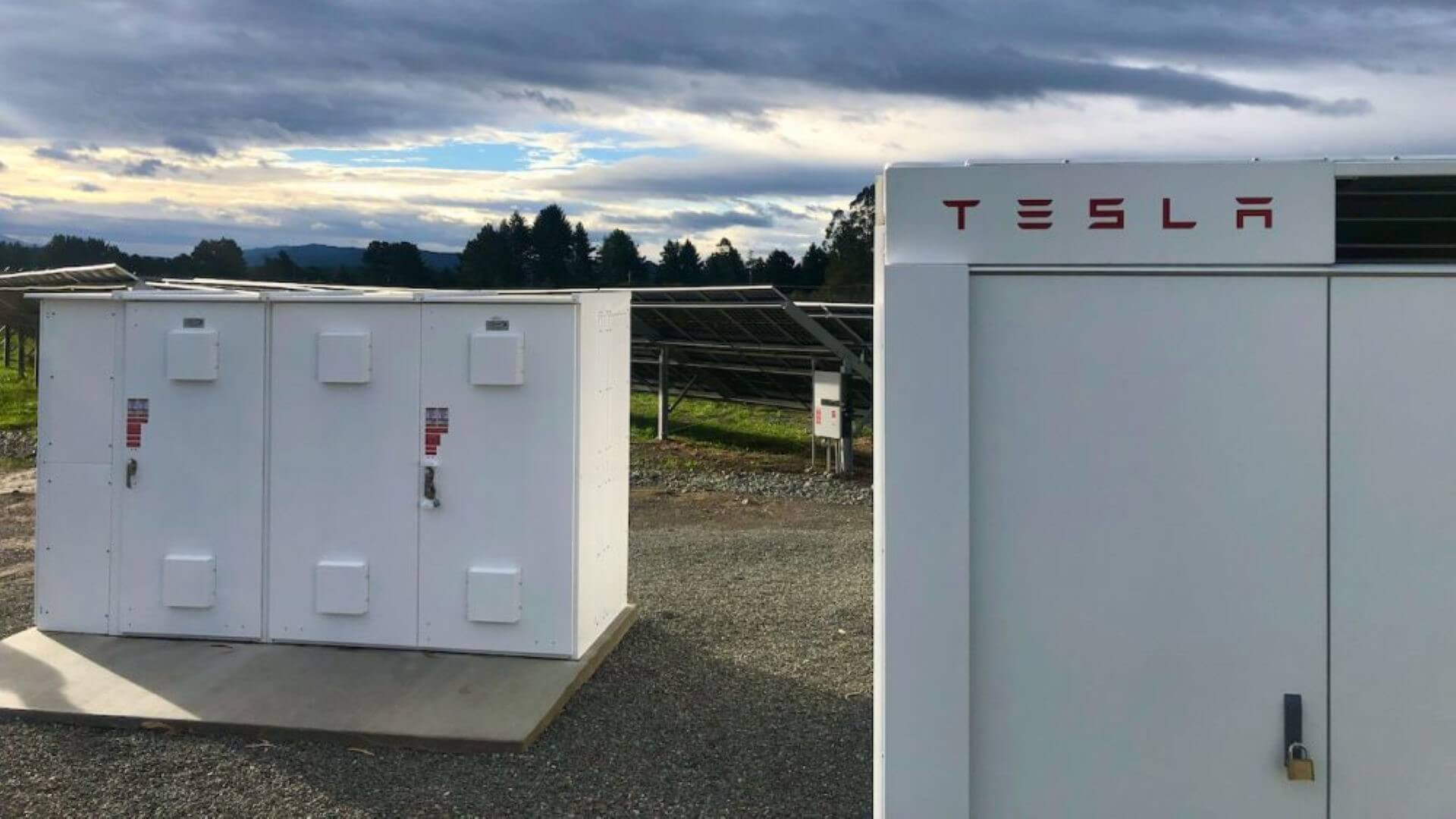 Two rectangular battery storage units outside