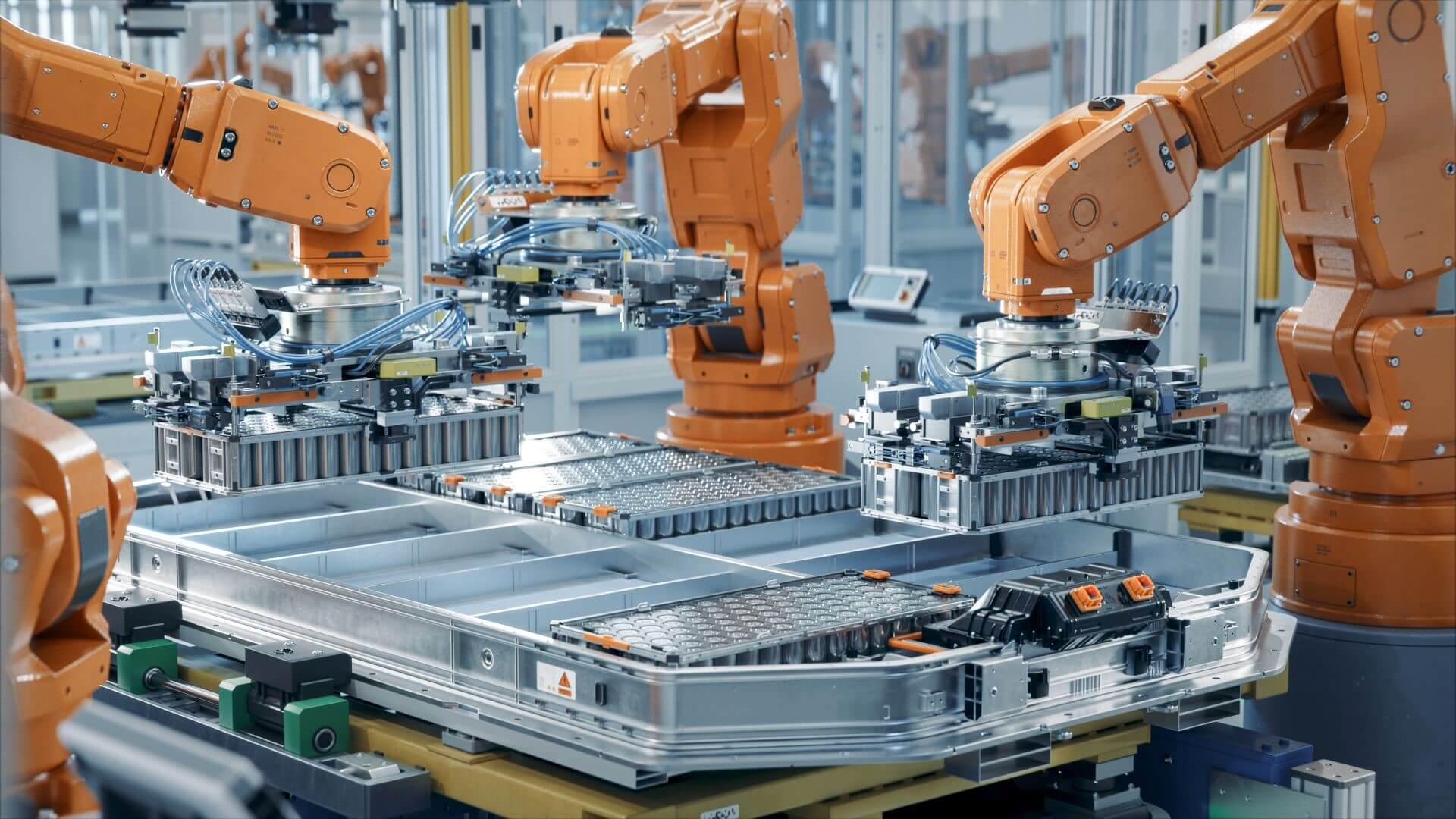 Robot arms assembling lithium ion batteries in factory