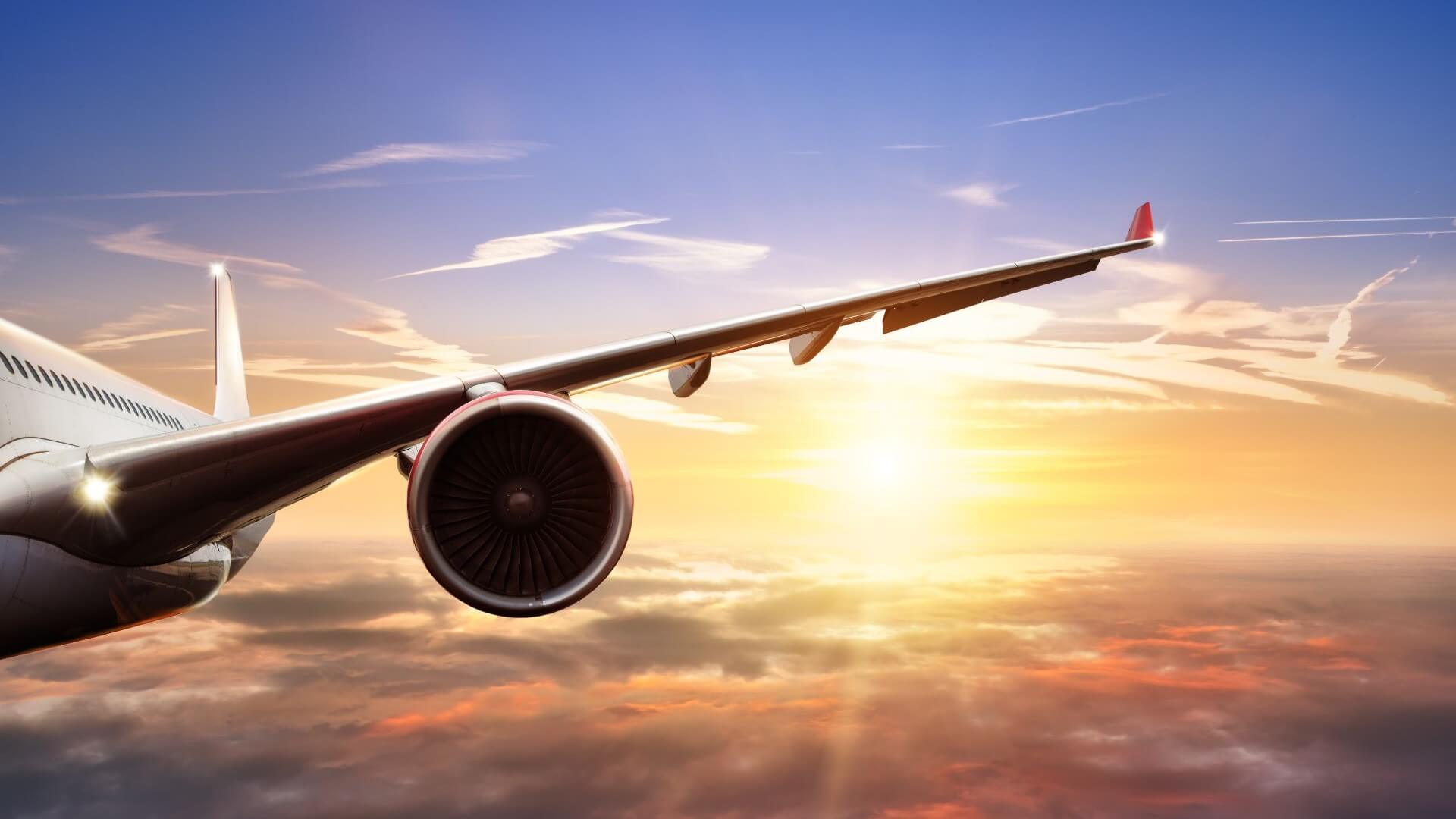 Close up of aircraft wing and engine during flight