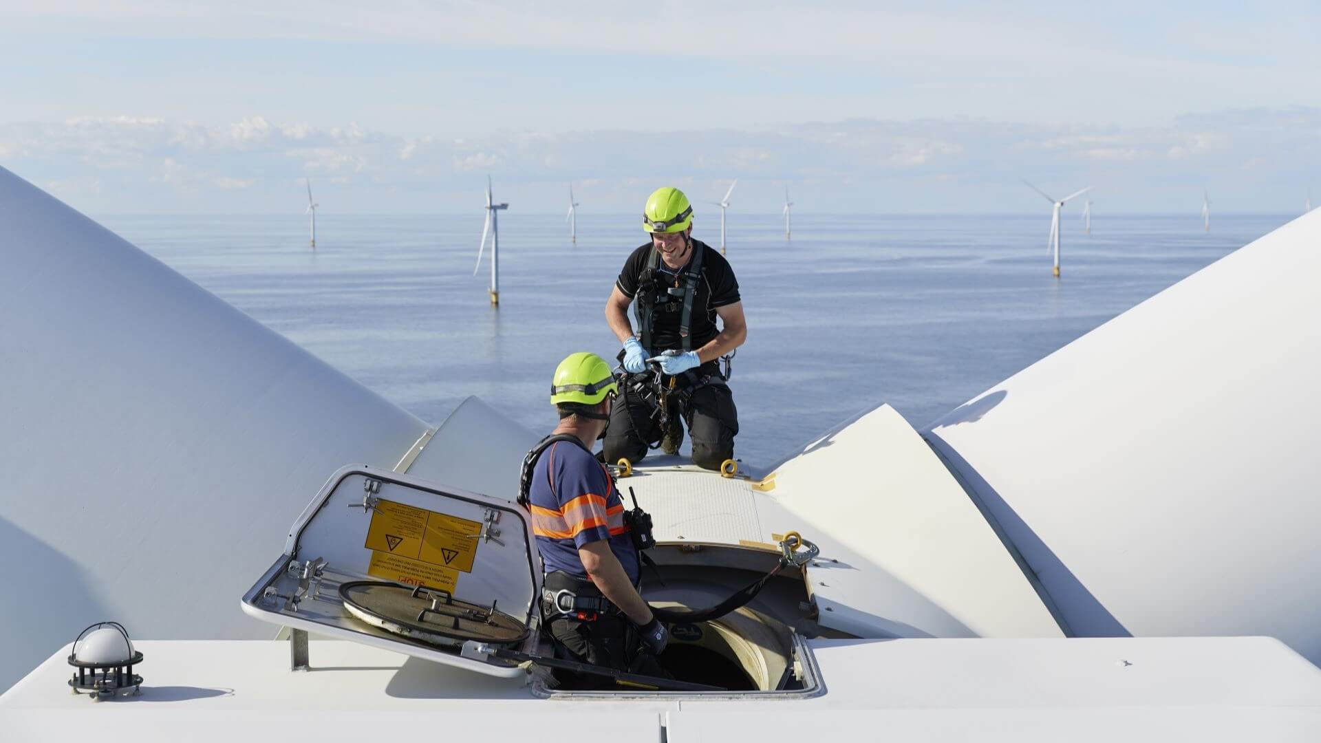 Two engineers working on offshore wind turbine