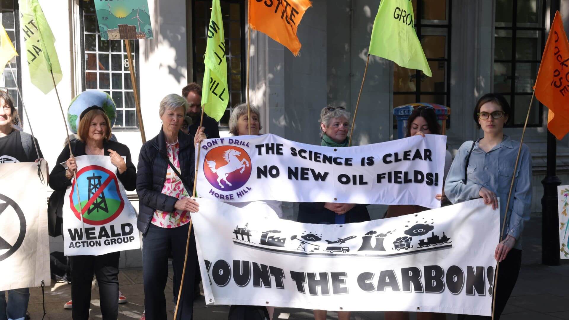 Demonstrators holding placards outside the UK Supreme Court