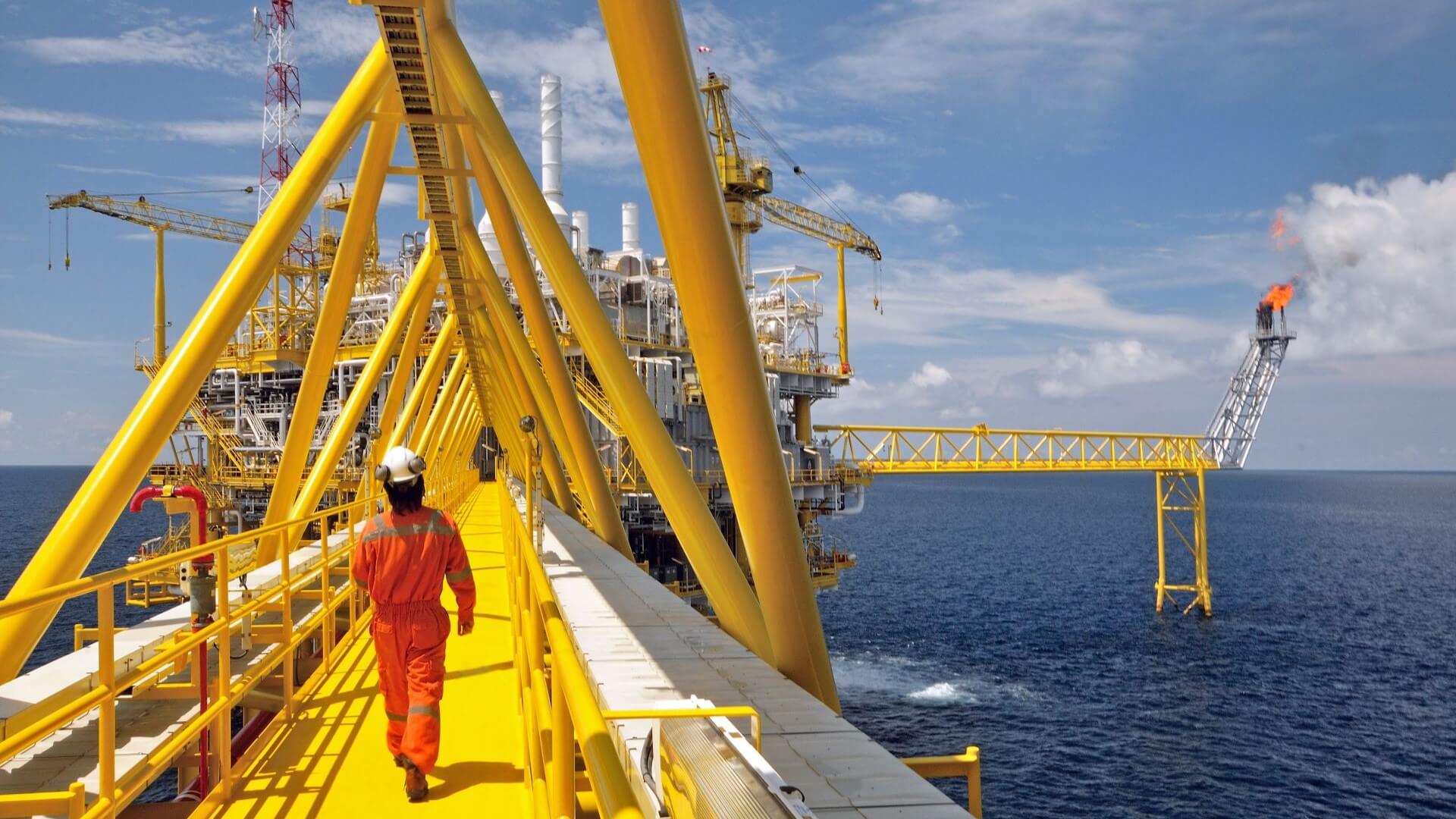 Engineer on offshore platform walkway