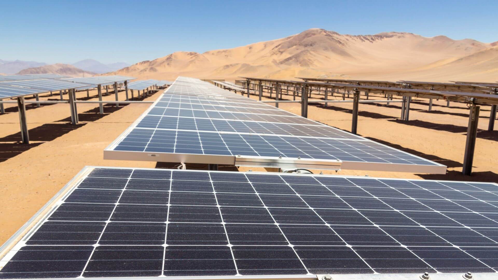 Close up row of solar panels in desert