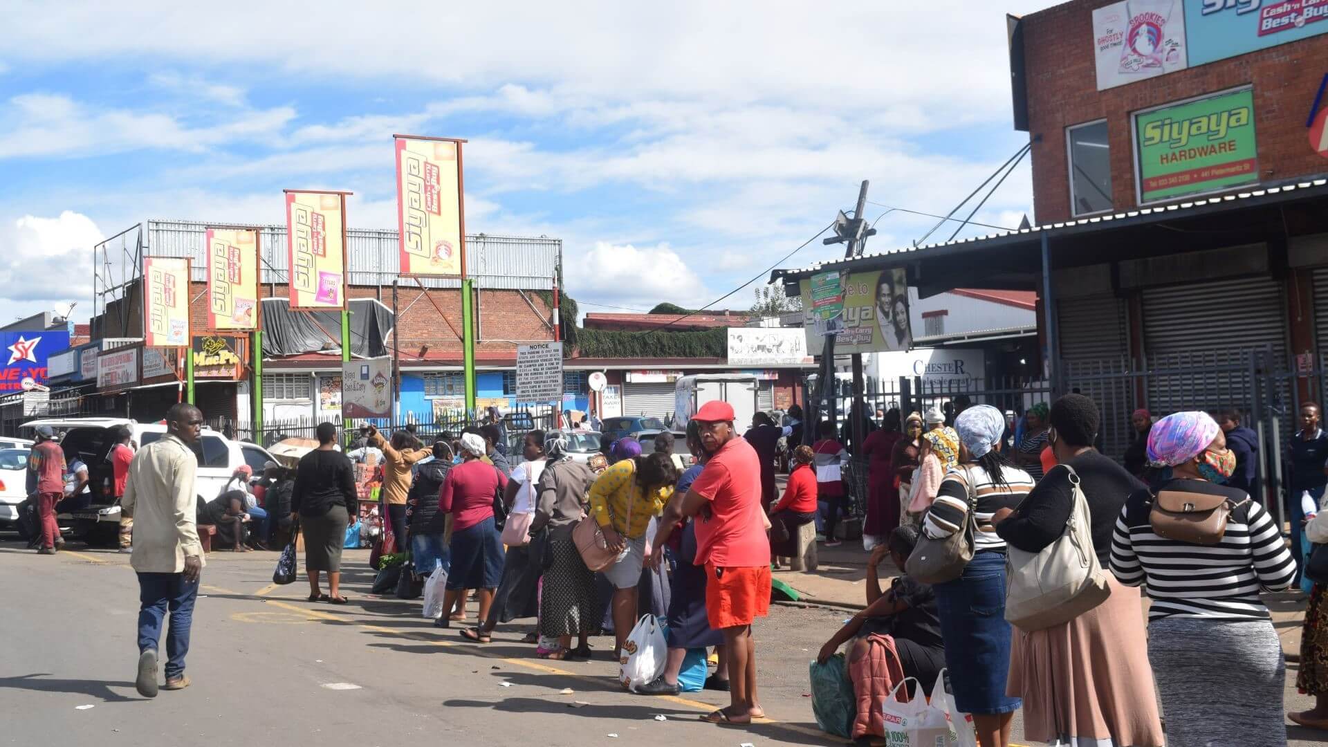 People queuing outside shops in South Africa