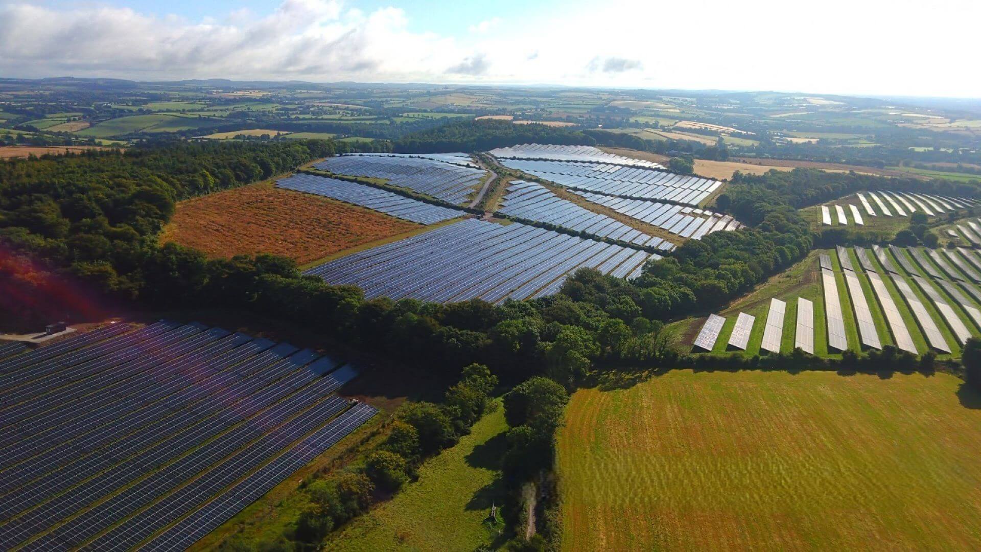 Aerial view of solar farm and surrounding fields