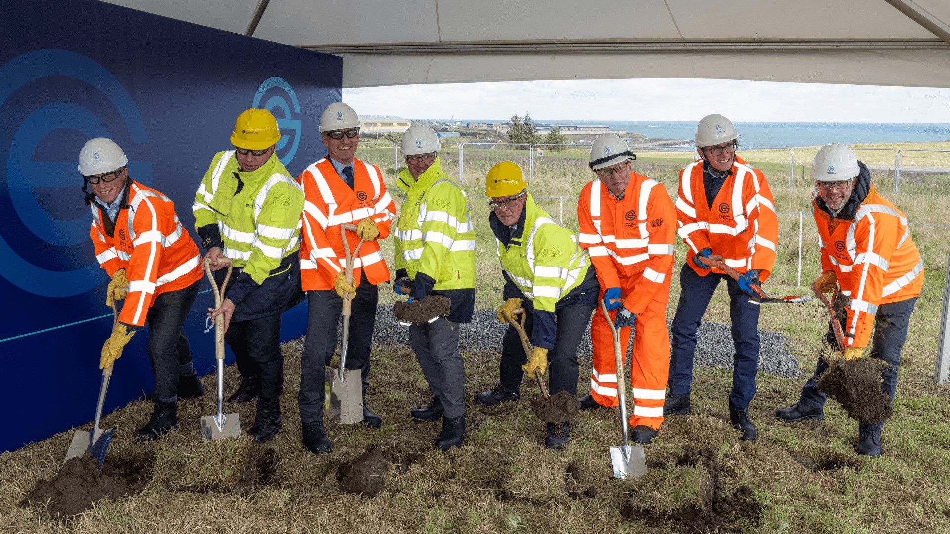 Eight officials during the breaking ground ceremony at Peterhead, Scotland