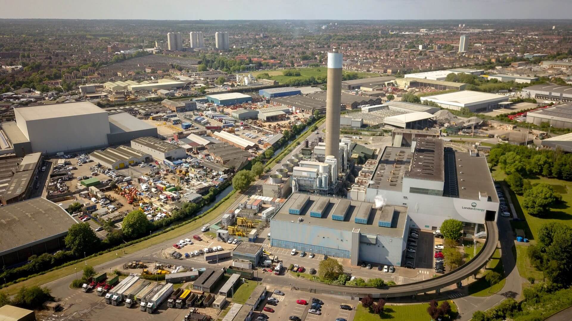 Aerial view over waste-to-energy power station and incinerator and surrounding industrial estate