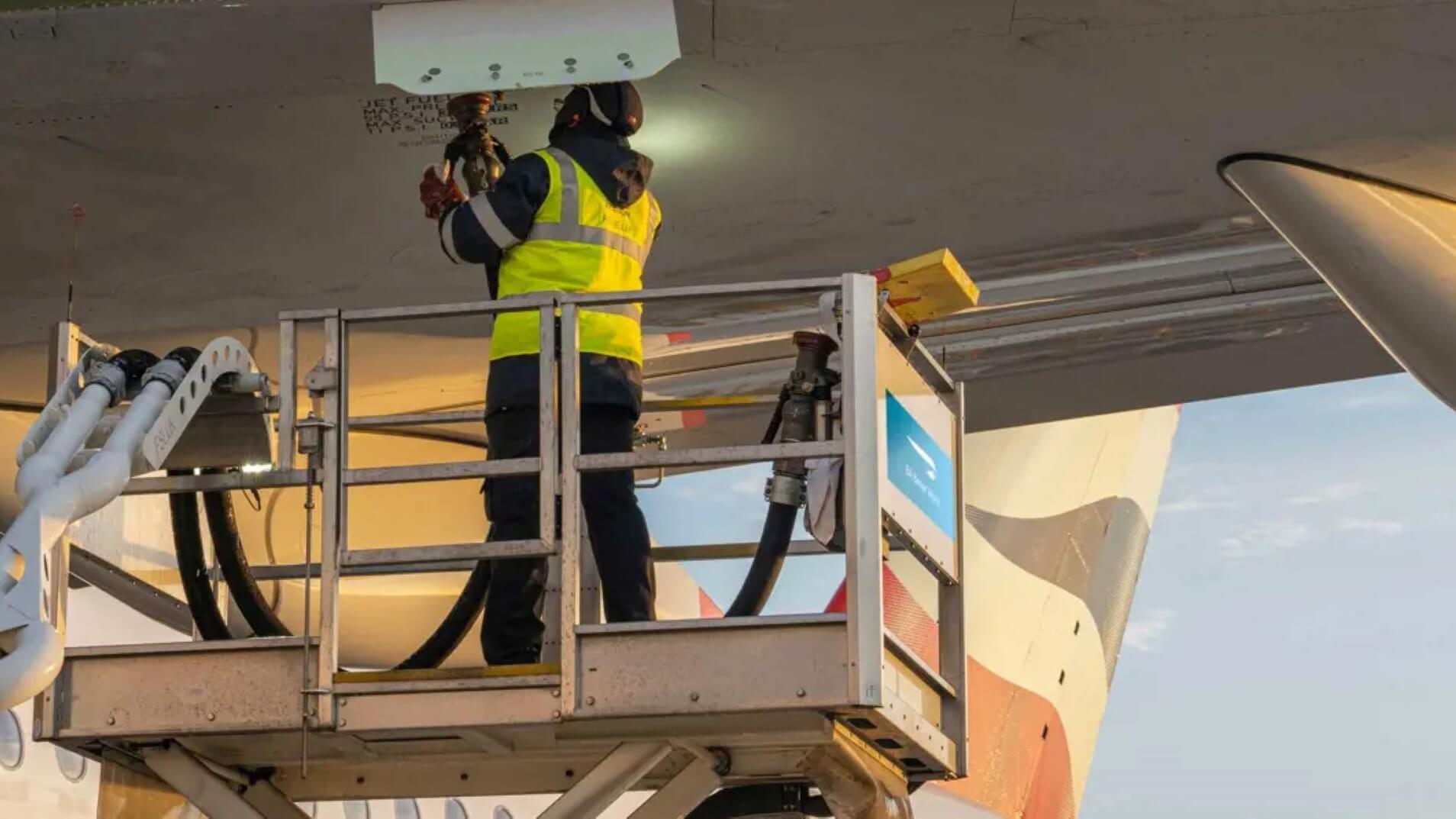 Man refuelling a British Airways aeroplane 